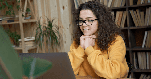 Teacher listening to Swiss Exams webinars - Don’t miss our webinars coming up next year